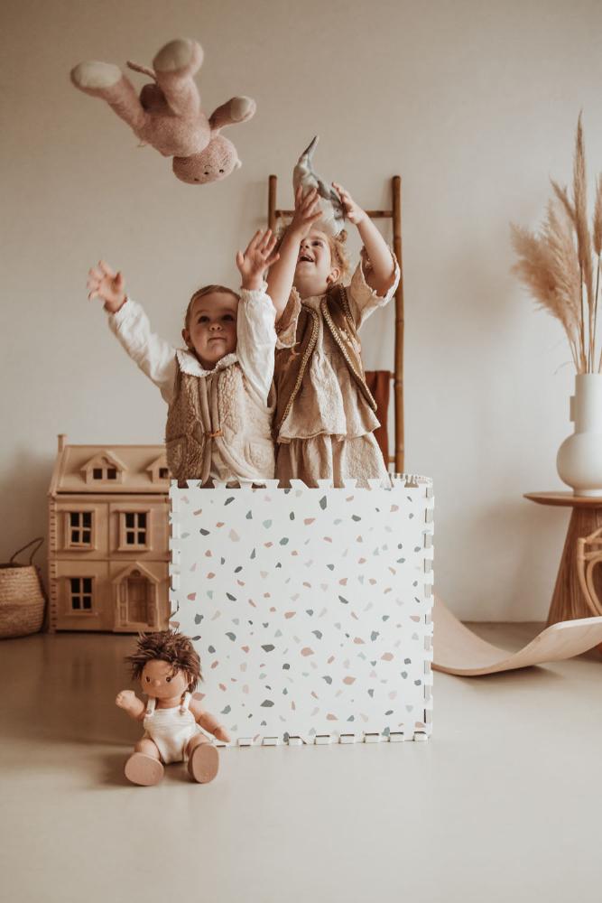 m_puzzlemat_children_inside_the_foam_box_throwing_their_cuddles_in_the_air_1